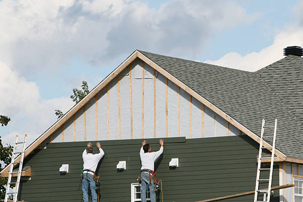 Professional Siding Repair technician working in Port Jefferson Station, NY